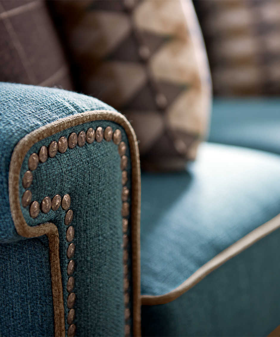 Living room with York Sofa with custom nailhead trim, welt and pillows