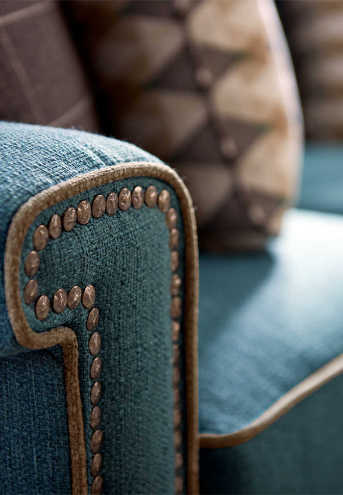 Living room with York Sofa with custom nailhead trim, welt and pillows