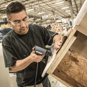 Worker assembling furniture